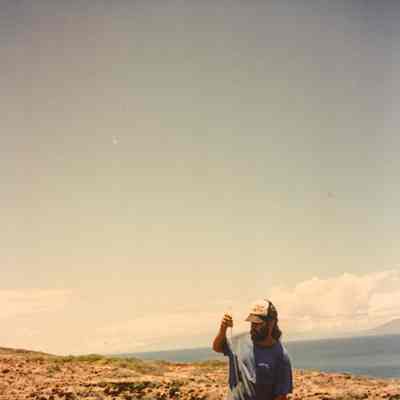 Man measuring at water catchment base