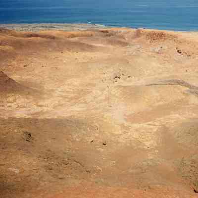 Hardpan landscape with ocean