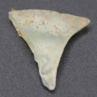 Closeup of triangular glass bottle fragment: Origformat: Artifact; Resolution: 200 dpi