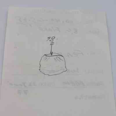 Back of artifact slip for artifact slip: The image shows a paper artifact slip with a hand-drawn sketch of an item accompanied by handwritten notes and measurements.