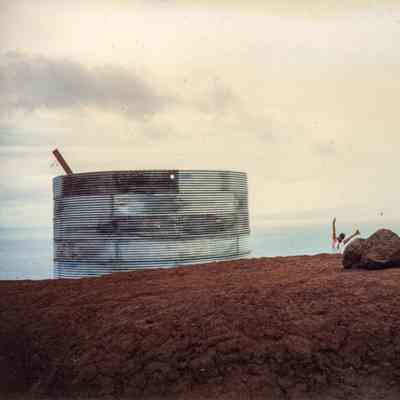 Water tank behind hardpan