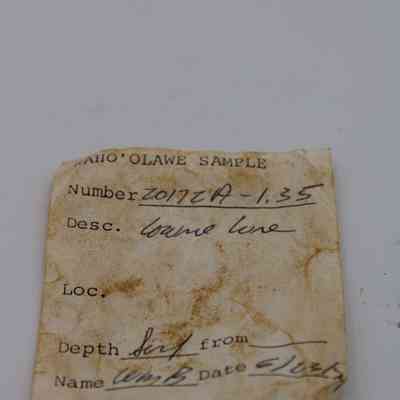 Artifact slip for cowrie lure: The image features an aged sample form from Kahoʻolawe, detailing a cowrie lure, including number, depth indicated as six feet