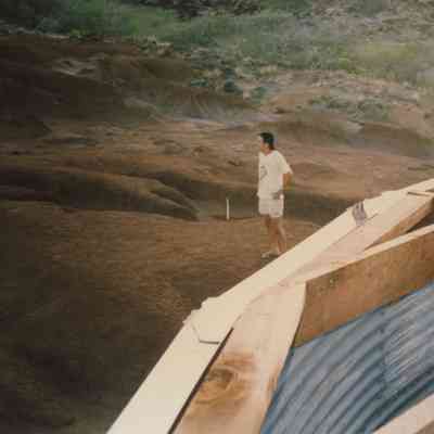 Man standing near water tank