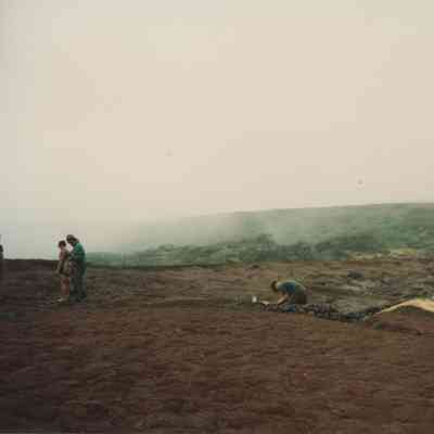 People working on hardpan terrain