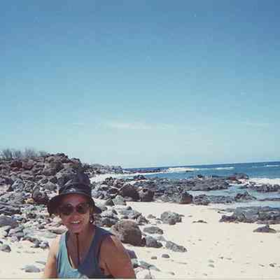 A woman on white sandy beach