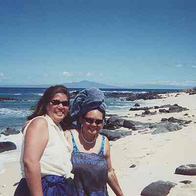 Two women on sandy white beach