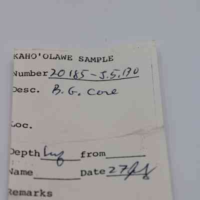 Artifact slip for basaltic glass core: The image shows an artifact slip labeled "Kaho'olawe Sample" with information like sample number, description, and date, handwritten.