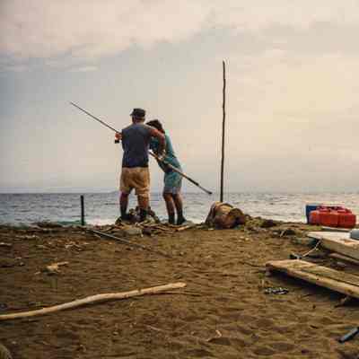 Two men working on an ulua pole and line