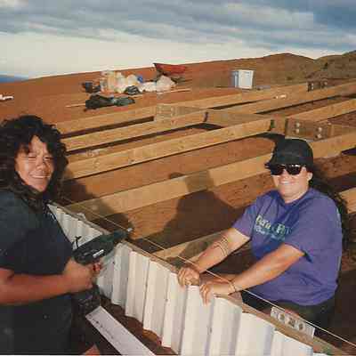 Two unidentified people at water catchment