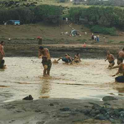 People playing in mud & water
