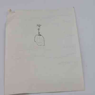 Back of artifact slip for glass flake: This image shows an artifact slip with a small hand-drawn diagram and a ruler placed at the bottom for scale reference.
