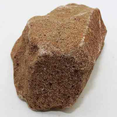 Lengthwise view of pumice file: The pumice stone in the image is rough-textured and brown.