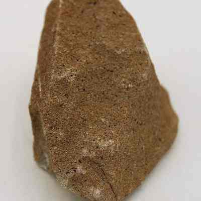 Lengthwise view of pumice file: A pumice stone is shown, primarily used for filing rough surfaces.