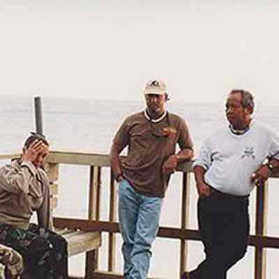 Group of people talking on observation deck at Base Camp