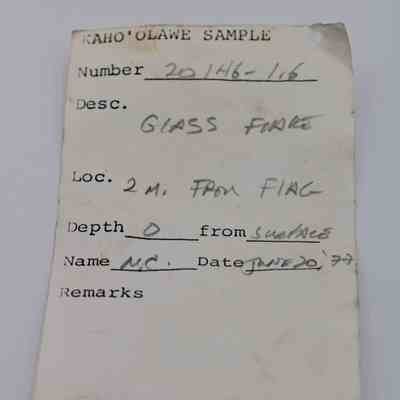 Artifact slip for glass flake: The image shows an artifact slip detailing a glass flake found two meters from a flag on June 20, 1997.
