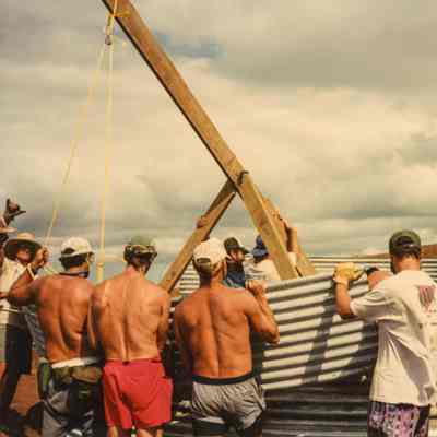 Men constructing metal water catchment