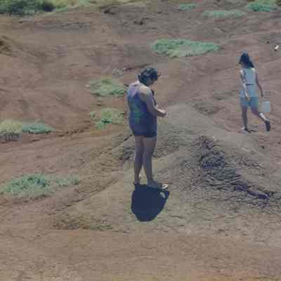 Three people on hardpan