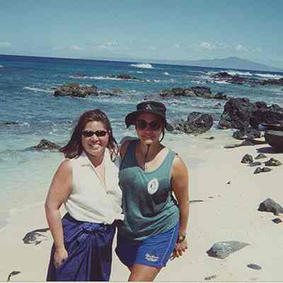 Two women on white sandy beach