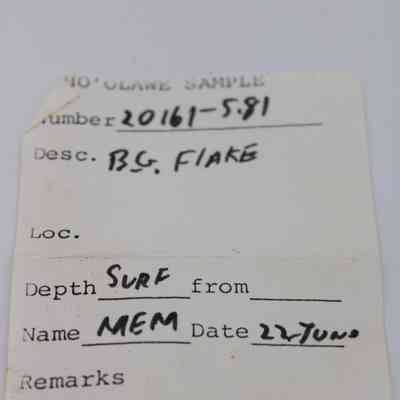Artifact slip for basaltic glass flake: The artifact slip contains details such as number "20161-5.81," description "BG. FLAKE," and surface depth information.