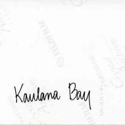 Back of photo (object #2010.001.365): The image shows a glossy photograph back with the text "Kaulana Bay" handwritten in black ink, along with visible Fujifilm Crystal Archive paper markings and a product code.