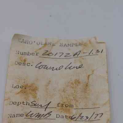 Artifact slip for lu he'e (cowry shell lure): The image shows a weathered artifact slip labeled "Kaho'olawe Sample" with handwritten details, including a date from 1977.