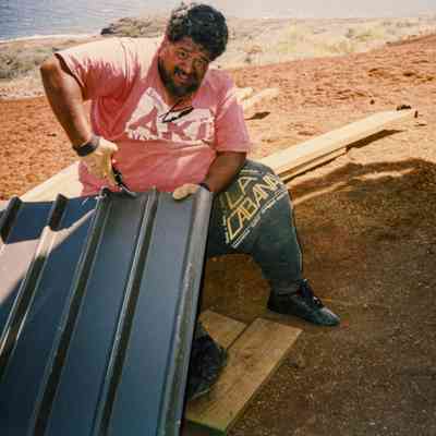 Man working on metal siding
