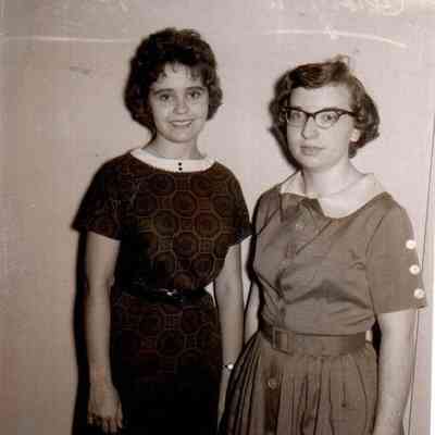 1962 Valedictorian Jo Ann Suroski (left) and Salutatorian Carolyn Ann Hiner smile as they prepare to finish out the school year.