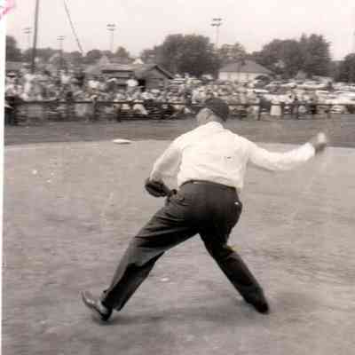Governor Happy Chandler throws out the opening pitch at Sportleigh Field while Harrodsburg Mayor D.L. Lacefield was the catcher. (May 1957)