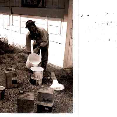 Haldon Wilham is pictured mixing paint for use in the horse barn in preparation for the 1963 horseshow