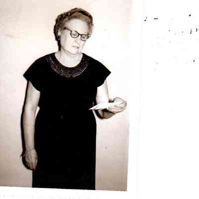 Mrs. Clyde Demaree, of the Progressive Homemakers Club, holding a receipt for the making of jellies and jams for the pending 4 day festival. (1961)