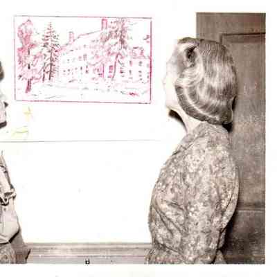 Mrs. Edward Ray (left) and Mrs. Floyd Wright (right) admire one of the many paintings of Shakertown village. They were painted by Jesta Bell Armstrong, a Harrodsburg artist.