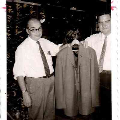Mike Rosetti holding the first jacket to be made at the Harrodsburg plant.