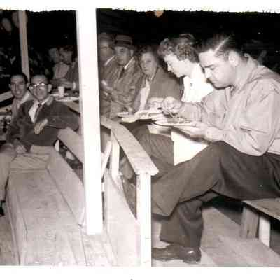 Cricketeer Employee Picnic. Pictured on the top row (L to R) are Hollis Edwards, Alvin Kurtz, Mrs. Kurtz, Pete Sabalis, Michael Rosetti, Mrs. Sabalis, Mrs. Rosetti, Mrs. DeHaven, and Pat DeHaven. The front row features John Humkey and Joe Rovner.