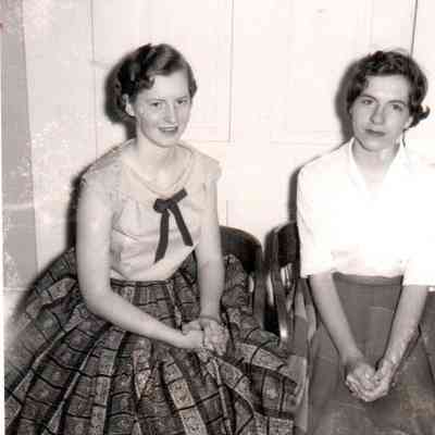 1958 Valedictorian Nancy Ellen Ison (left) and Salutatorian and Becky Lynn John pose for a photo.
