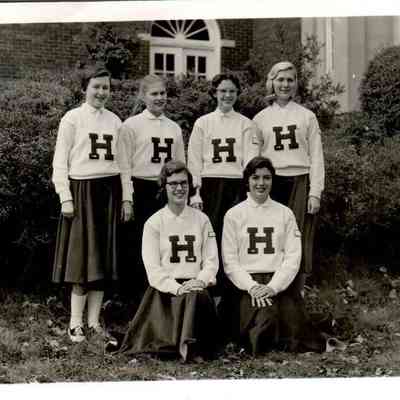 Pictured Front Row (L to R): Ann Huddleston, Carol Cummins Back Row: Sara Allison, Mary Lou Lyons, Jennie Lou Flynn, and Bonnie Sims. (1956-1957)