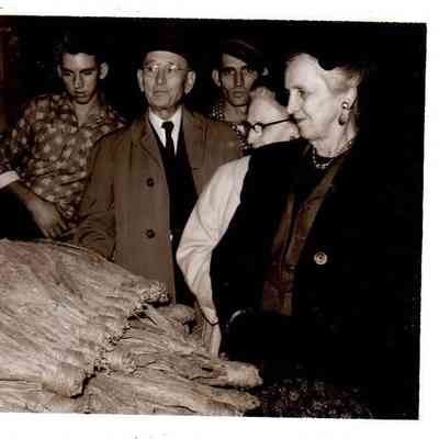 Mrs. T. Hassell Bowen (right) and her husband Rev. Dr. T. Hassell Bowen look over her tobacco crop in 1961.