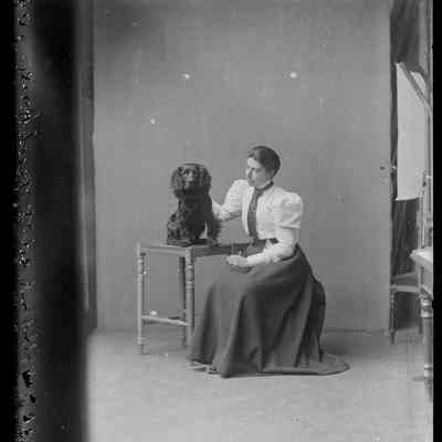 negative, glass plate - Miss I. Golland and dog, Beck House, 1896