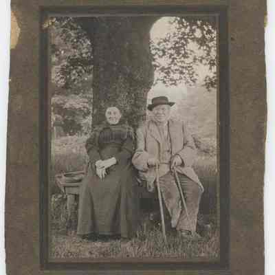 photograph, b&w - Portrait : Lady and Gentleman seated under a tree
