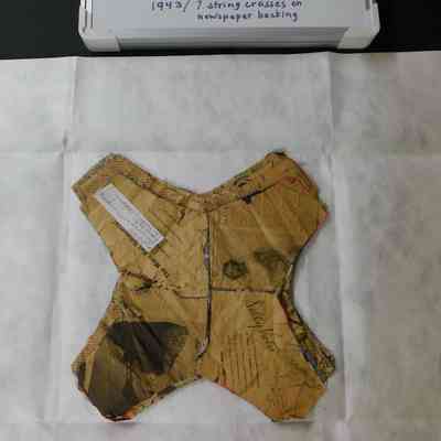 Untitled (String Crosses with Newspaper Backing)