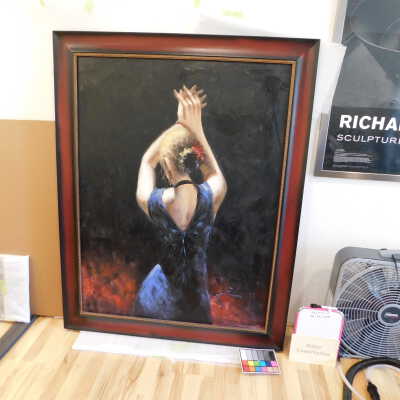 Woman in blue dress with raised arms