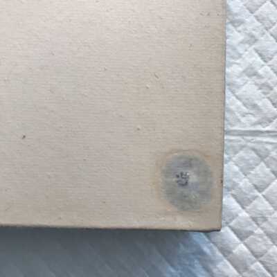 In progress detail shot bottom left corner. After sanding back white oil paint to realign texture, it is decided that due to a bulge from the nail head and projected difficulties in colour/texture matching, this line of work will not be continued and the discoloured paper will be removed and the problematic nails below also removed. 