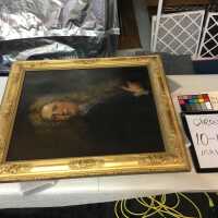Man in wig painting