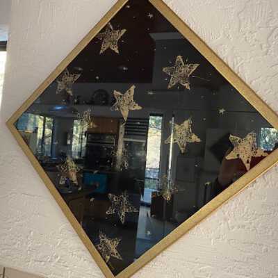 Stars in gold diamond-shape frame