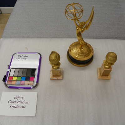 Emmy with two golden globes