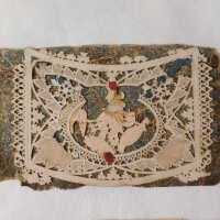          Before treatment; Loose fly leaf and a piece of paper cutting
