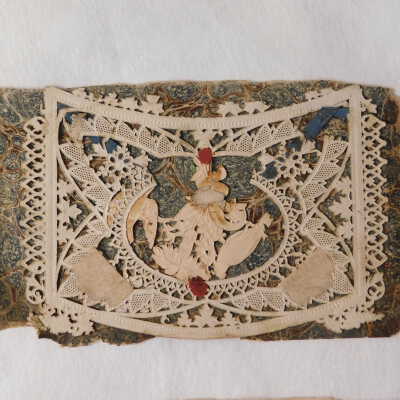 Before treatment: Loose fly leaf and a piece of paper cutting