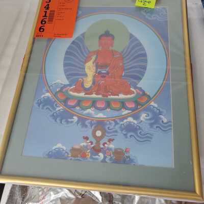 Red seated figure with blue background