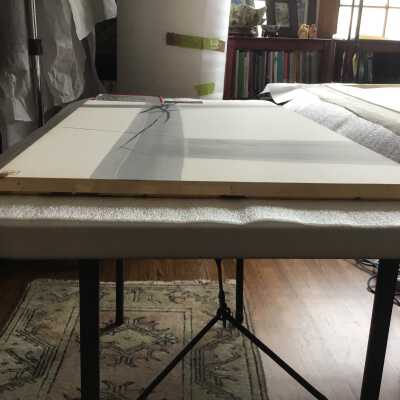 Before conservation - discolored edge of paper at the bottom. The discolored rusty patch on the left partially present at turn over edge. 