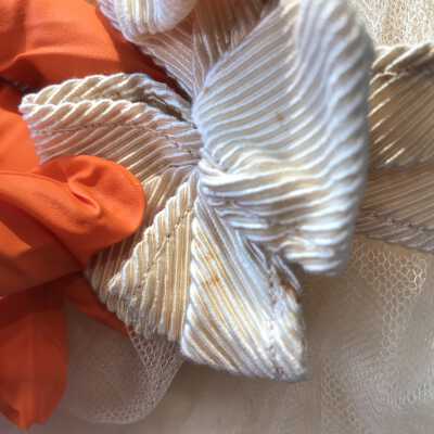 Staining on right sleeve bow