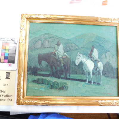 Two Native Americans against green sky and hills